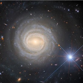 Image - Hubble Captures a Bright Galactic and Stellar Duo
