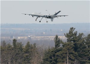 MQ-9 flies above trees near Fort Drum, N.Y. 
