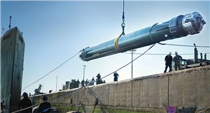 MK48 torpedo is lowered into a Navy submarine